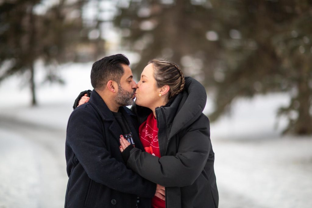 couple kissing in the snow