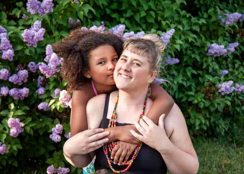 mother and daughter with lilacs