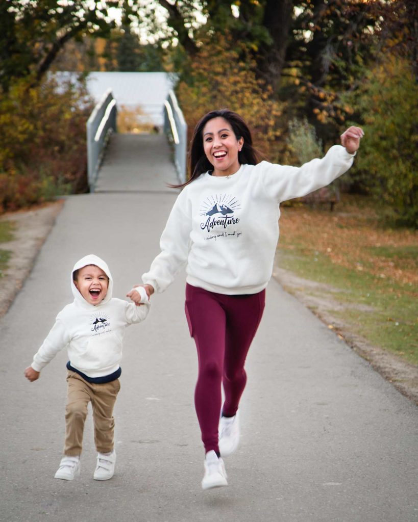 mother and son running in the park