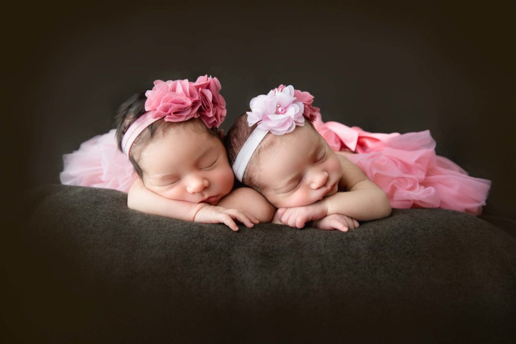 newborn twins in pink tutus