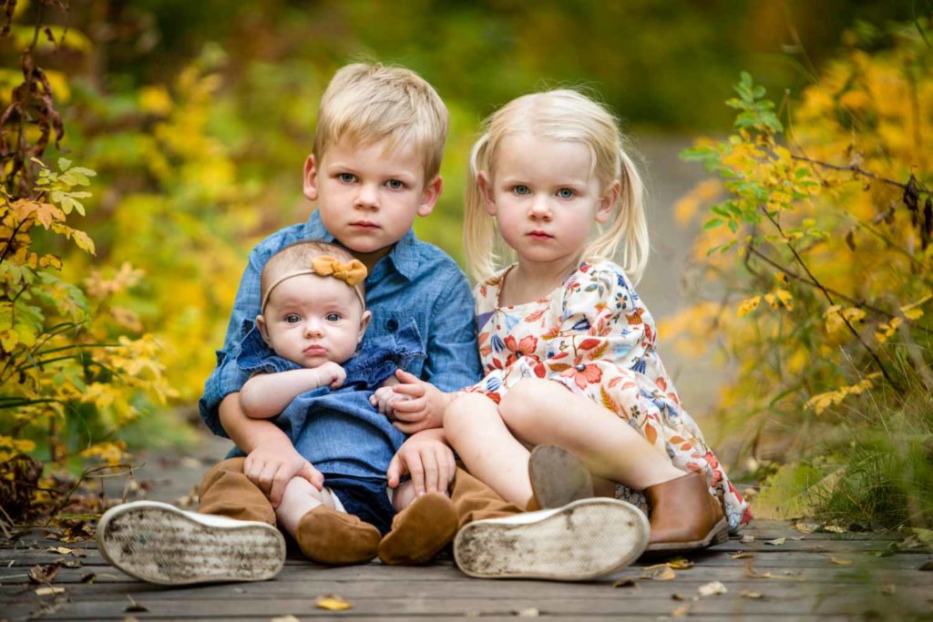 3 siblings on the board walk