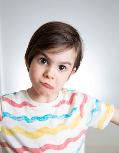 preschool boy making funny faces