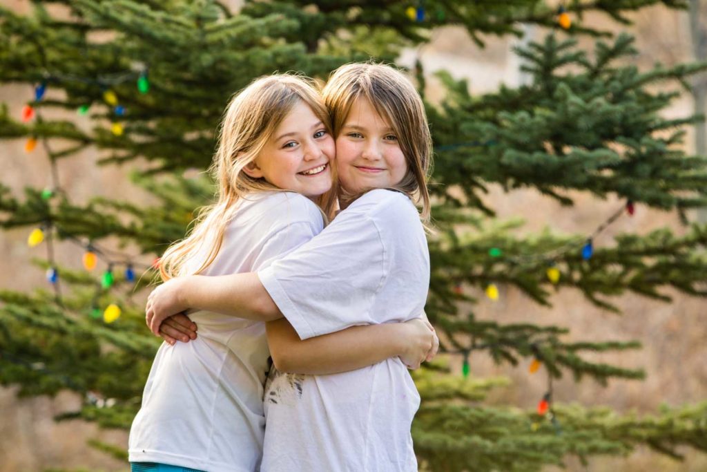 teen siblings hugging