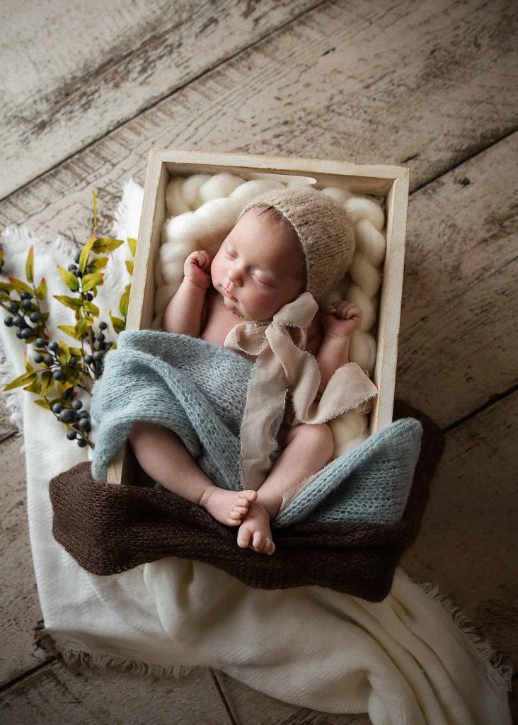 newborn baby in a box