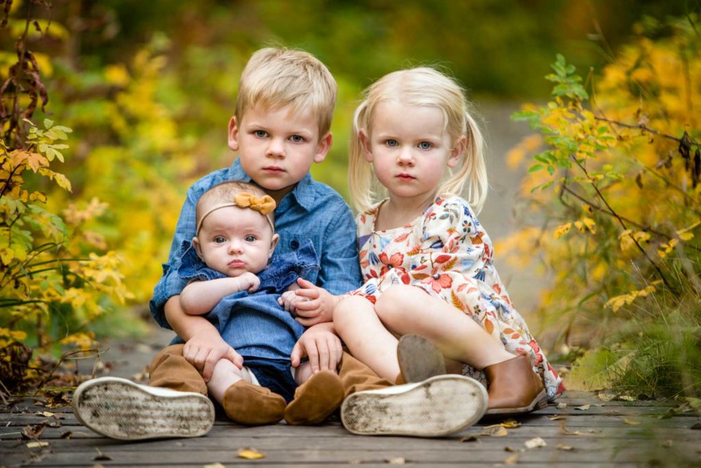 three siblings in the park