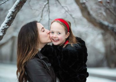 mom and daughter in the snow