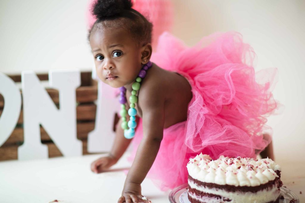 baby girl with pink tutu and cake