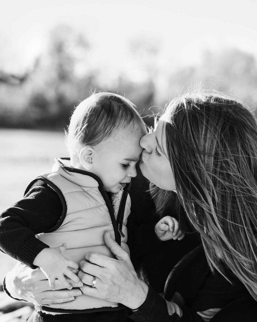 mother kissing her baby