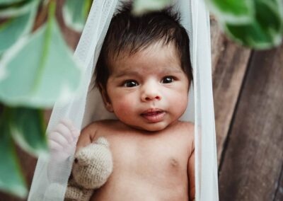 Newborn baby in a hammock