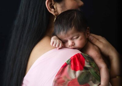Newborn baby in mom's arms