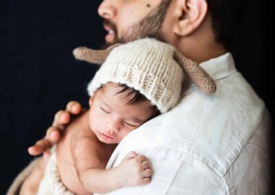 father holding baby