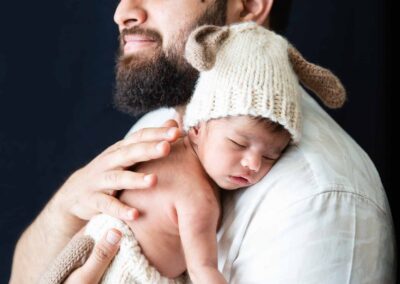 father holding baby