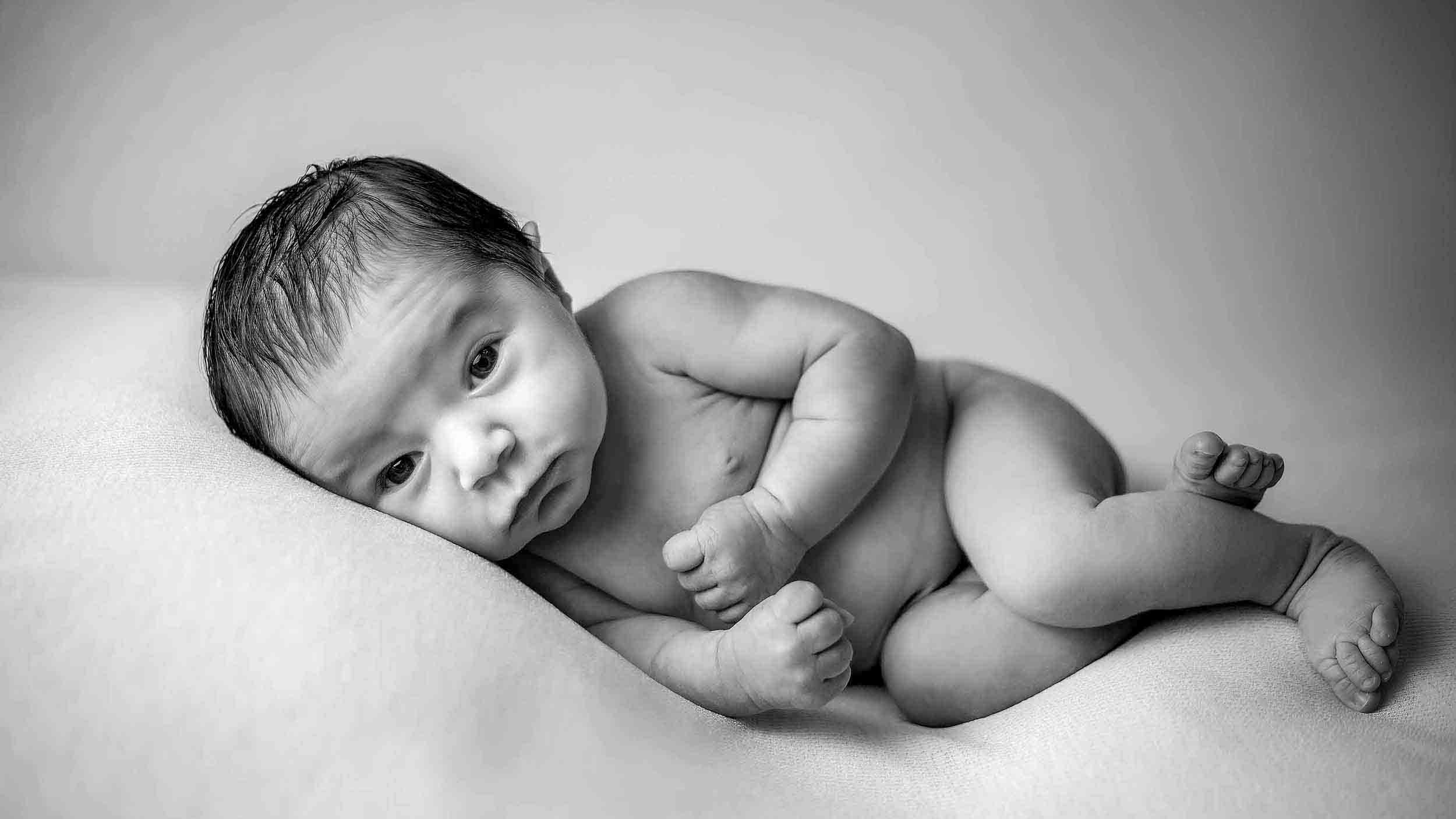 newborn baby lying sideways