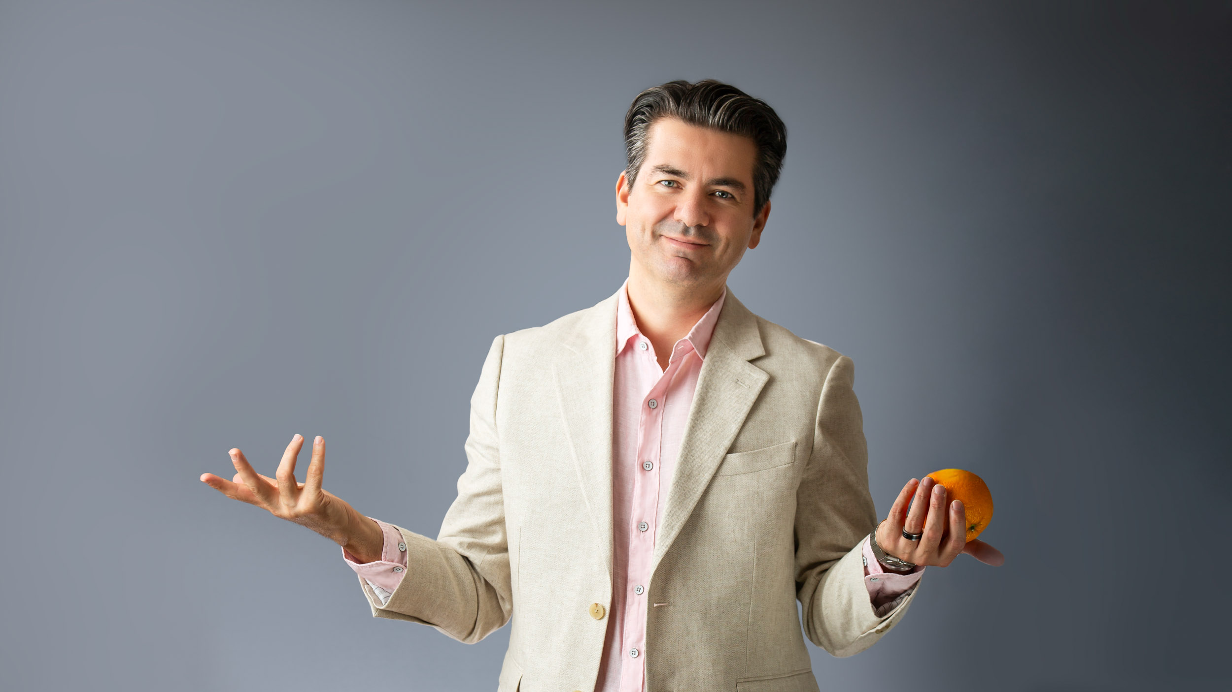 middle age man wearing a light suit -CEO-Headshot in Calgary