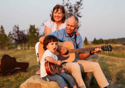 grandma-grandpa and grandchild-playing guitar