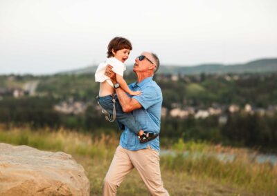 grandpa holding up his 3 year old grandson