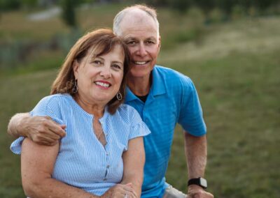 Grandparents sitting together at sunset during family session