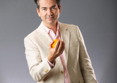 man holding an orange-Professional Headshot-Calgary